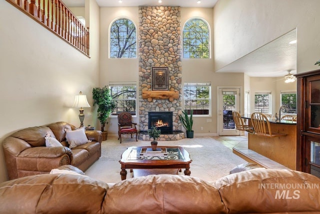 3283 Willow Cir, Twin Falls, ID 83301 - living room with a fireplace, a towering ceiling, ceiling fan, light colored carpet, and recessed lighting