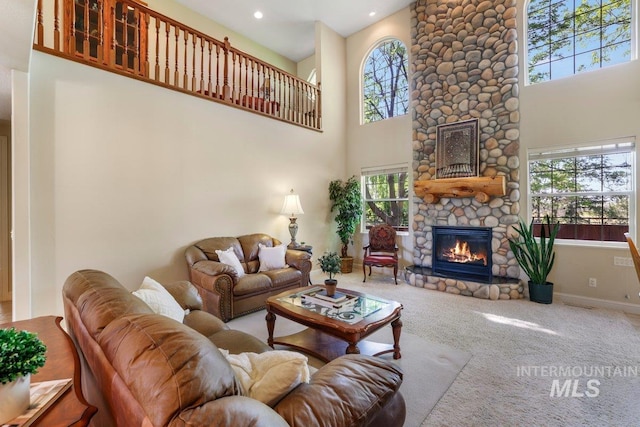 3283 Willow Cir, Twin Falls, ID 83301 - carpeted living room featuring a stone fireplace, plenty of natural light, a towering ceiling, and recessed lighting