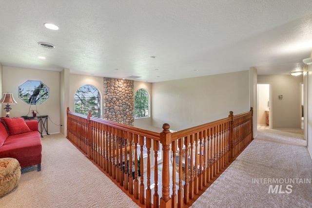 3283 Willow Cir, Twin Falls, ID 83301 - corridor with light carpet, a textured ceiling, and recessed lighting
