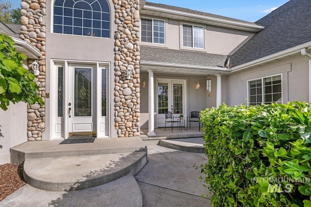 3283 Willow Cir, Twin Falls, ID 83301 - view of exterior entry featuring stucco siding, roof with shingles, and covered porch