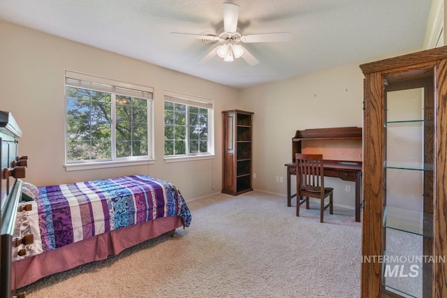 3283 Willow Cir, Twin Falls, ID 83301 - carpeted bedroom with baseboards and ceiling fan