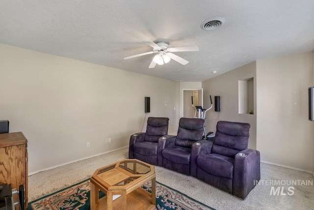 3283 Willow Cir, Twin Falls, ID 83301 - home theater featuring a ceiling fan, carpet, and a textured ceiling