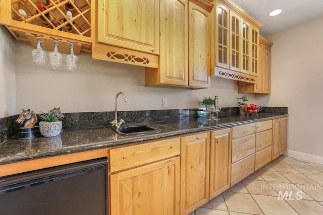3283 Willow Cir, Twin Falls, ID 83301 - kitchen featuring dishwasher, light tile patterned floors, glass insert cabinets, light brown cabinets, and recessed lighting