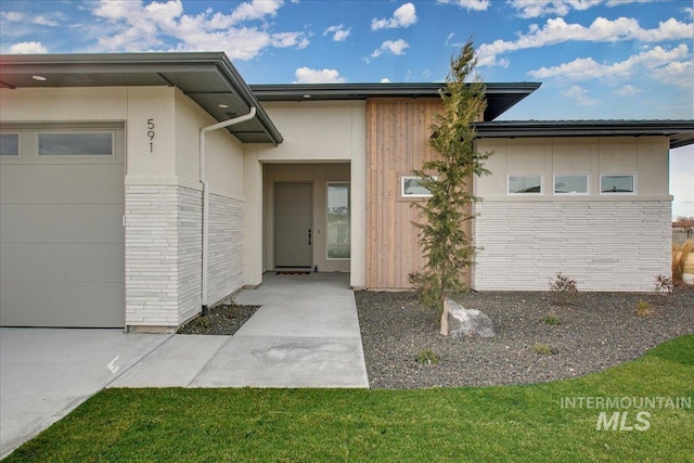 view of exterior entry featuring a garage