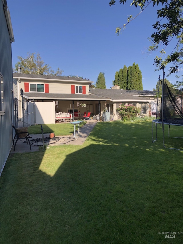 2726 Fairmont Dr, Burley, ID 83318 - view of grassy yard with a trampoline and a patio