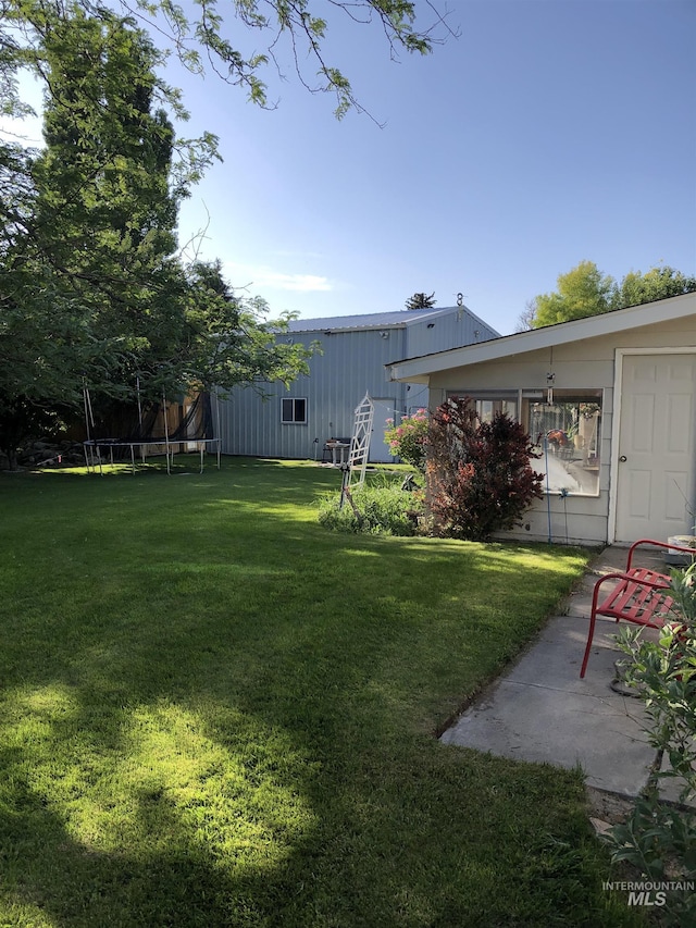 2726 Fairmont Dr, Burley, ID 83318 - view of green lawn featuring a trampoline