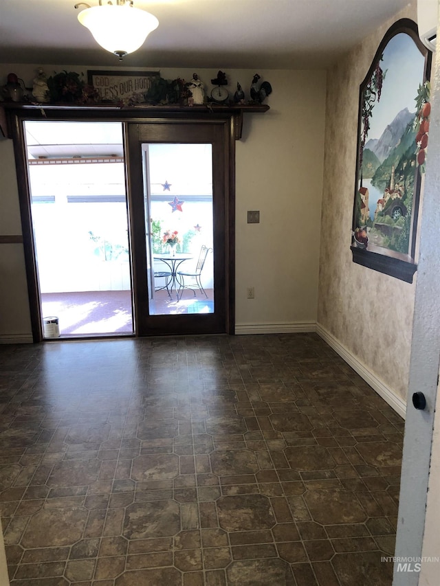 2726 Fairmont Dr, Burley, ID 83318 - spare room featuring a wall mounted AC and dark stone finish floors