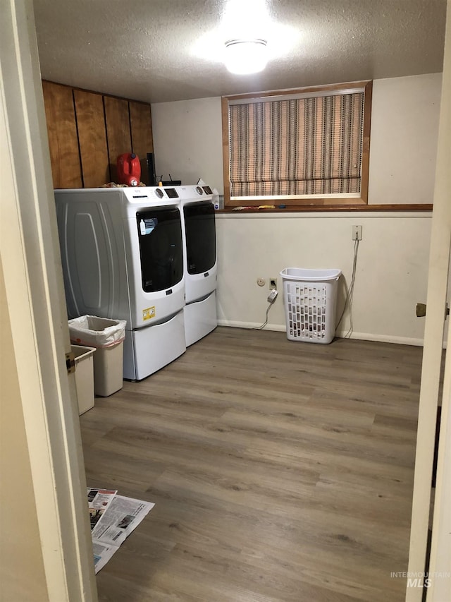 2726 Fairmont Dr, Burley, ID 83318 - laundry room with independent washer and dryer, a textured ceiling, and wood finished floors