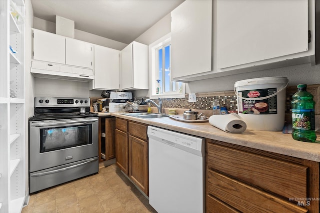 10435 W Seneca Dr, Boise, ID 83709 - kitchen featuring stainless steel electric range oven, white dishwasher, a sink, light countertops, and under cabinet range hood