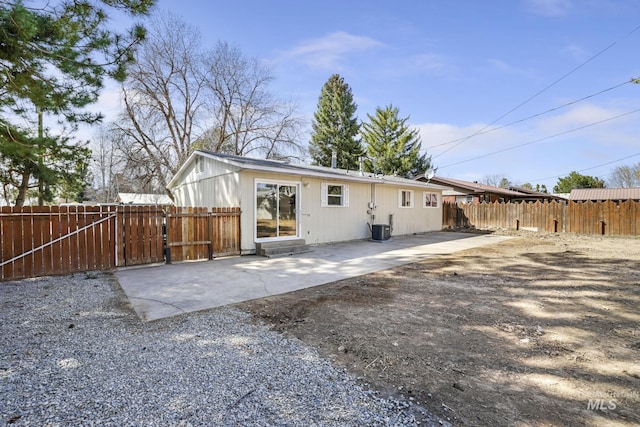 back of house with a patio area, fence, and central AC unit