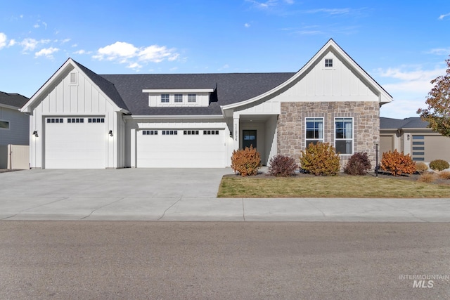 view of front of house with a garage and a front lawn