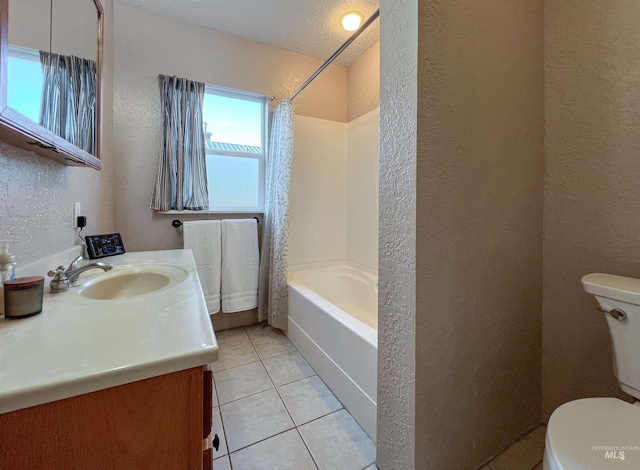full bath featuring a textured wall, toilet, tile patterned floors, vanity, and shower / bath combination with curtain