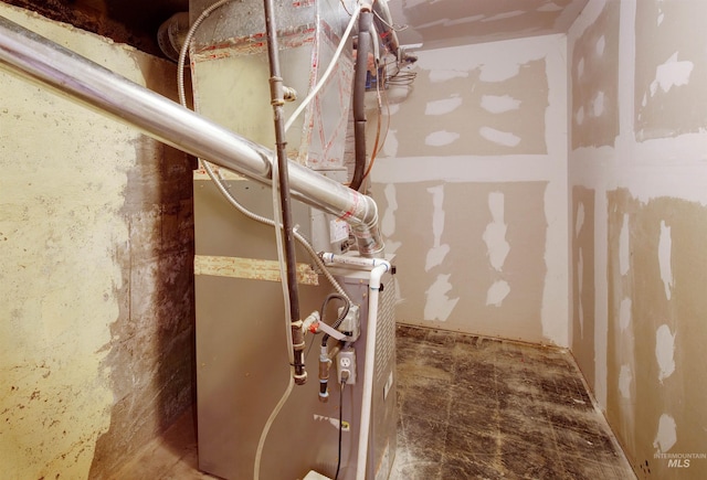 utility room featuring heating unit