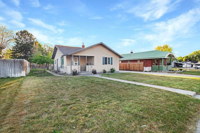 view of front of property featuring covered porch and a chimney