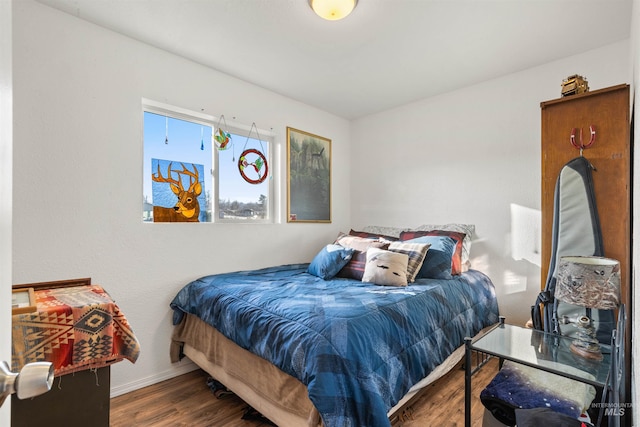 bedroom featuring dark hardwood / wood-style flooring