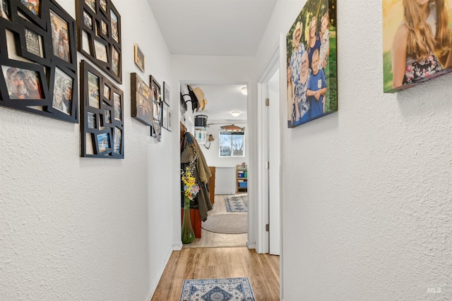 hallway with light wood-type flooring