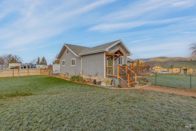 view of side of property featuring a lawn