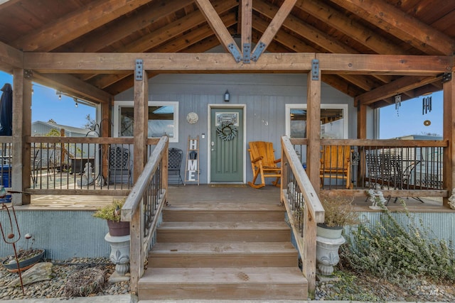 doorway to property featuring covered porch