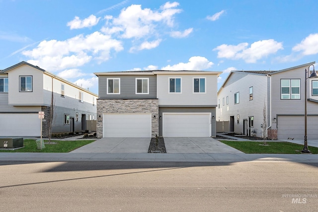 view of front of property featuring cooling unit, stone siding, concrete driveway, and an attached garage