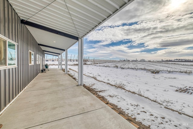 view of snow covered patio