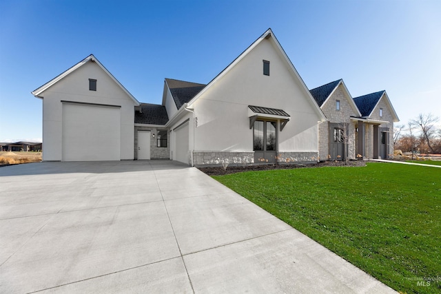 modern inspired farmhouse with a front yard and a garage