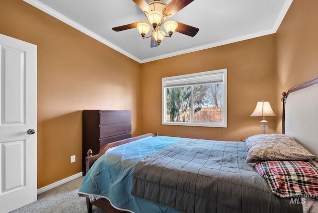 bedroom featuring ceiling fan, crown molding, and light carpet