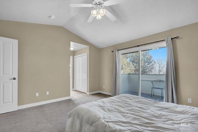 carpeted bedroom featuring ceiling fan, a textured ceiling, vaulted ceiling, access to outside, and a closet