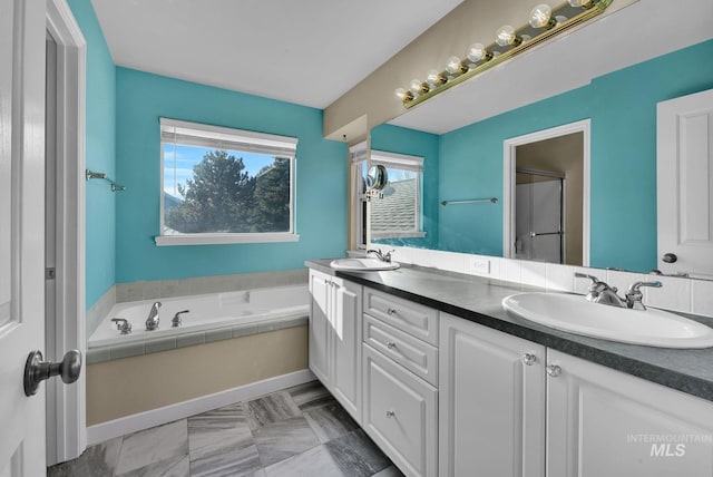 bathroom with vanity and a bathing tub