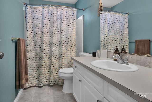 bathroom featuring walk in shower, tile patterned flooring, vanity, and toilet