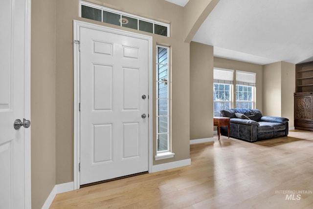 foyer entrance with light hardwood / wood-style flooring