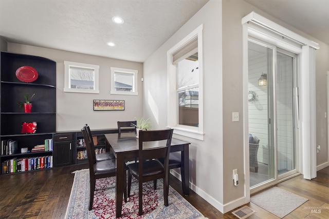 dining area featuring recessed lighting, visible vents, baseboards, and wood finished floors