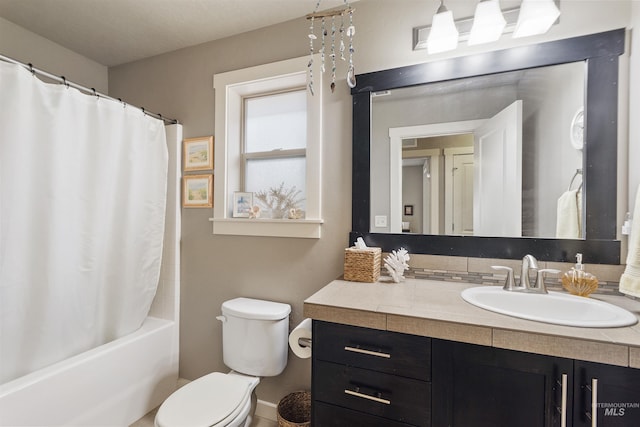 full bath featuring toilet, vanity, and shower / tub combo with curtain