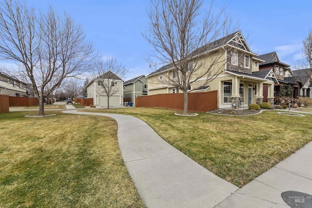 view of home's exterior featuring a yard and fence