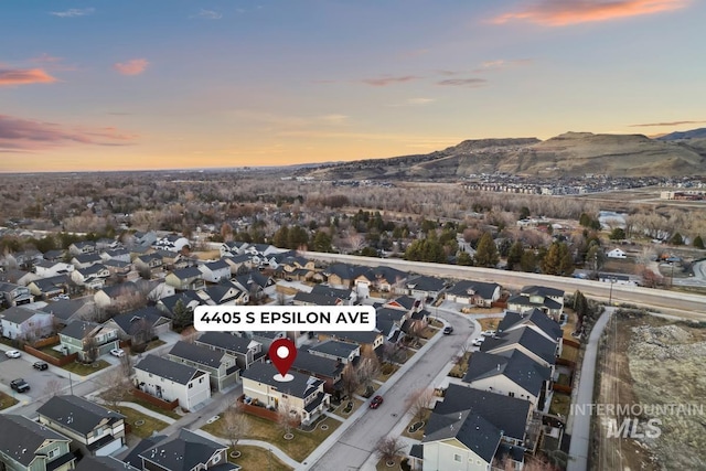 aerial view at dusk with a residential view and a mountain view