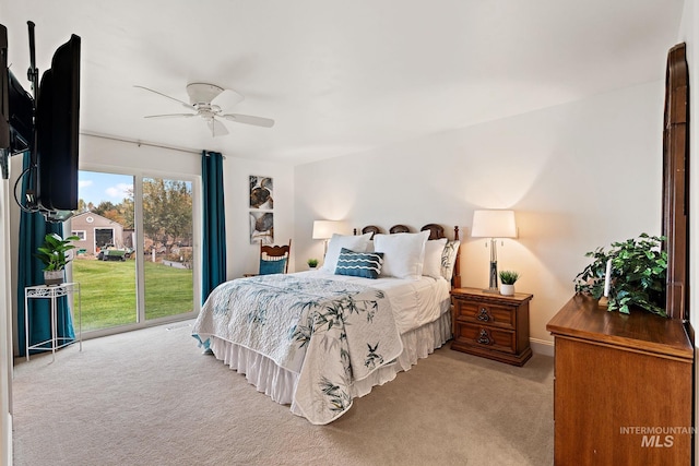 bedroom with light carpet, access to outside, and ceiling fan