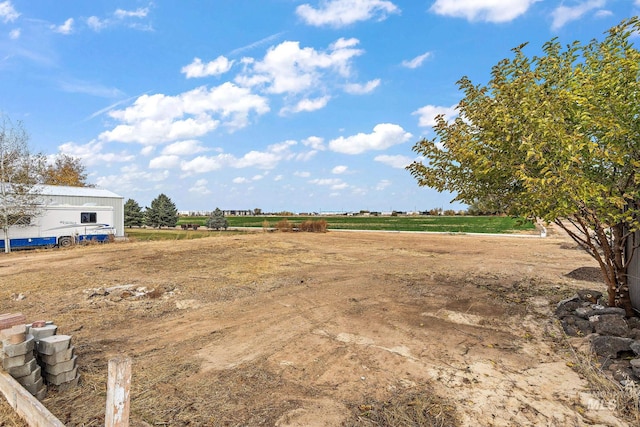 view of yard with a rural view