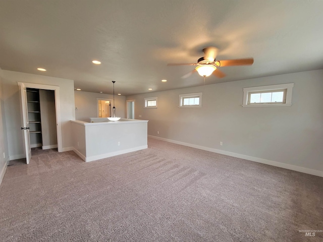 unfurnished living room with baseboards, recessed lighting, and ceiling fan