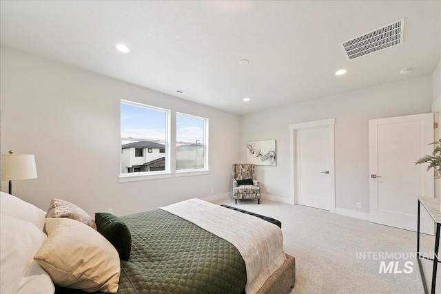 carpeted bedroom featuring visible vents, recessed lighting, and baseboards