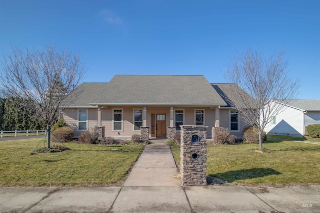 view of front of home with covered porch and a front lawn