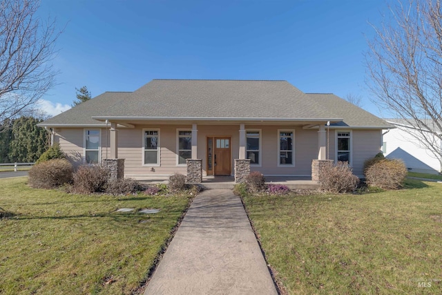 view of front of home featuring covered porch and a front yard