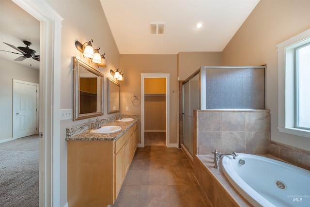 bathroom featuring double sink, tile floors, ceiling fan, and a wealth of natural light