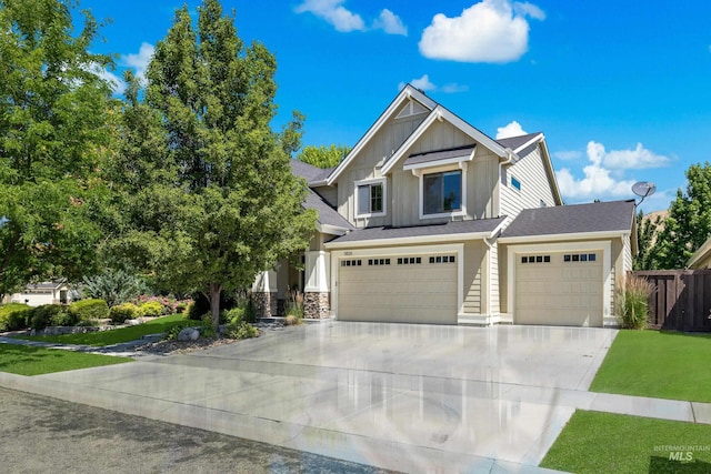 5826 E Playwright St, Boise, ID 83716 - craftsman-style home with board and batten siding, driveway, and a garage