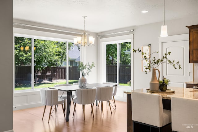 5826 E Playwright St, Boise, ID 83716 - dining room with a chandelier and light wood-type flooring