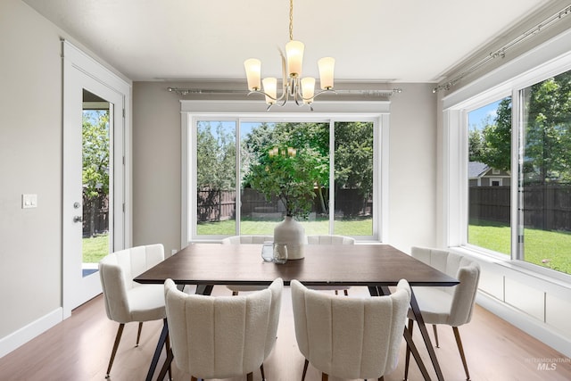 5826 E Playwright St, Boise, ID 83716 - dining room featuring a chandelier, light wood finished floors, and plenty of natural light