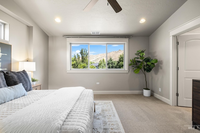 5826 E Playwright St, Boise, ID 83716 - bedroom featuring light colored carpet, ceiling fan, recessed lighting, and a textured ceiling
