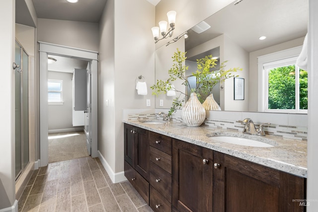 5826 E Playwright St, Boise, ID 83716 - full bathroom with double vanity, healthy amount of natural light, and a shower with door