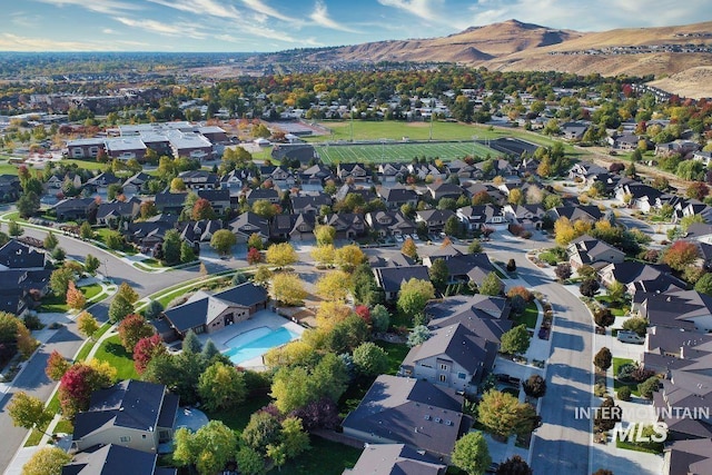5826 E Playwright St, Boise, ID 83716 - aerial view of property and surrounding area featuring a mountainous background and nearby suburban area