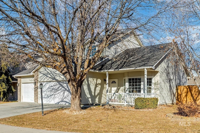 view of front of property featuring a garage and a porch