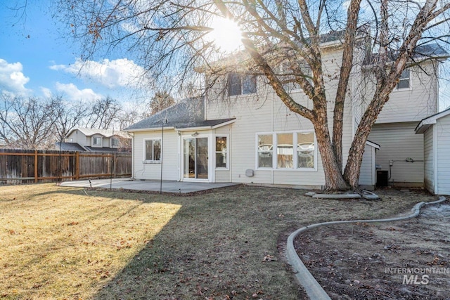 back of property featuring a patio, a yard, and central AC unit