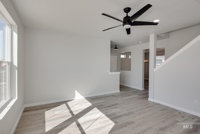 4353 N Magical Creek Ave, Meridian, ID 83646 - spare room featuring baseboards, ceiling fan, and light wood finished floors